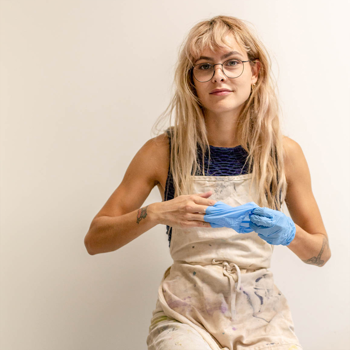 Picture of Artist Molly Supplee taking out gloves from hands
