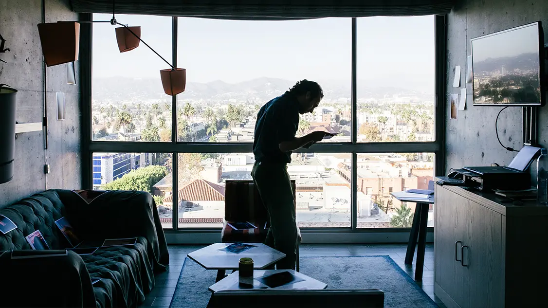 Man reading the newspaper in the afternoon