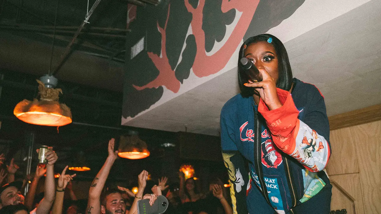 Girl is singing a song in front of audience