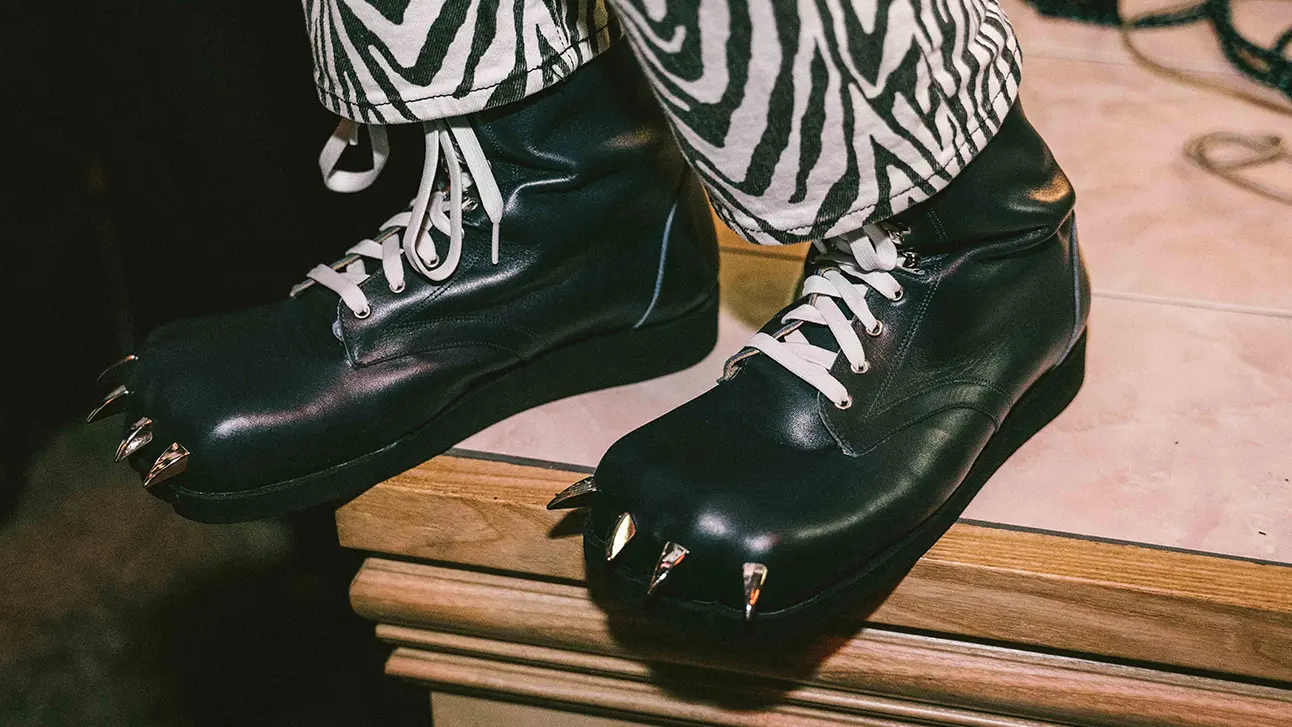 Black leather shoe with spikes on the front