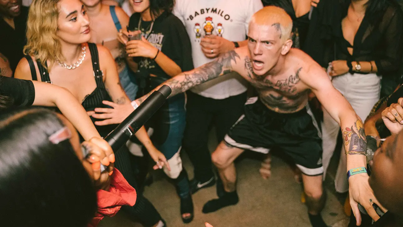 Naked man dancing with the crowd