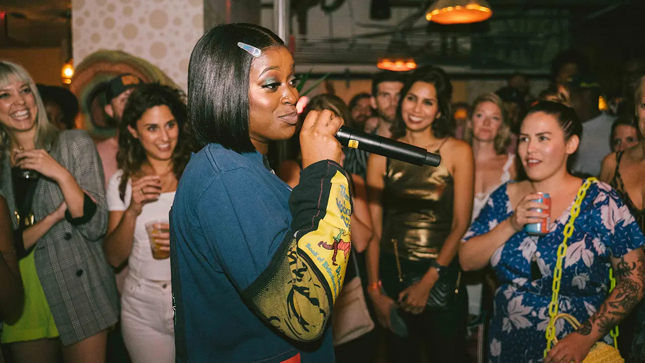 Girl is singing a song in front of audience