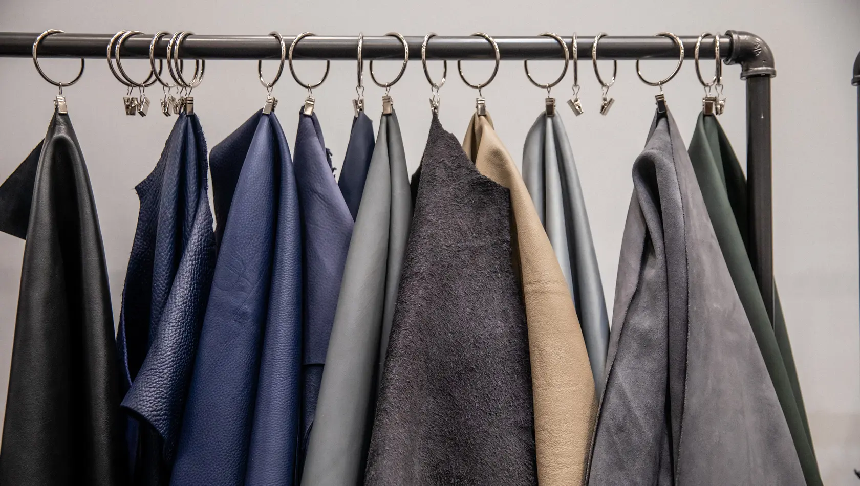 Many suits hanged in the rack