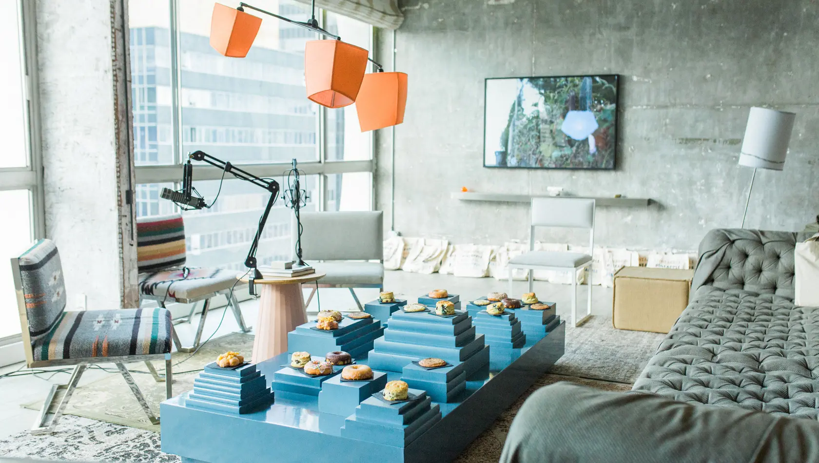 Grey room with sofa and doughnut on blue table