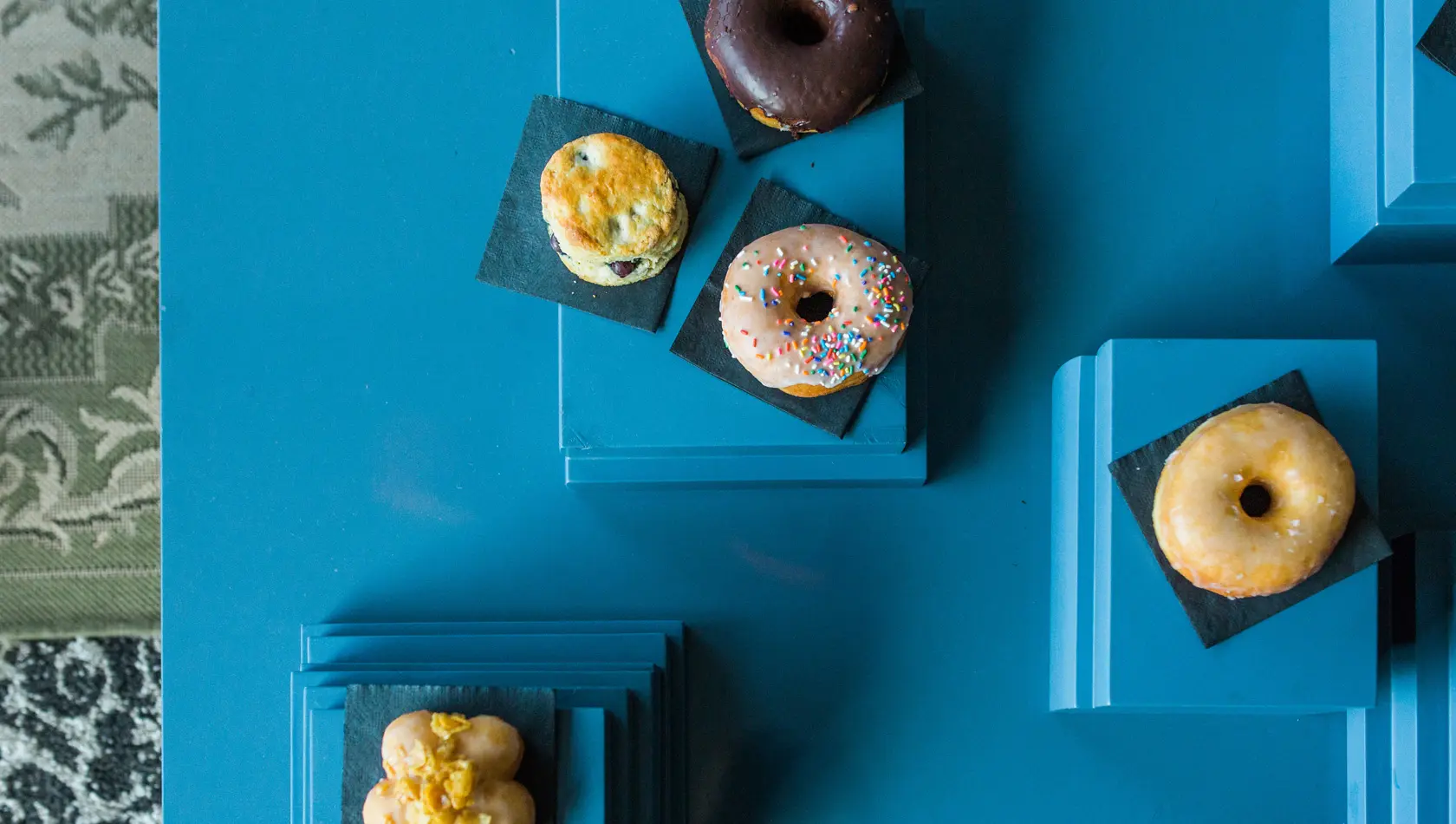 doughnuts kept on blue table