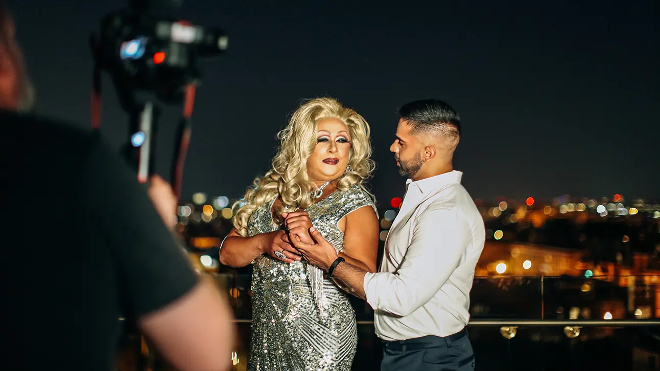 standing in the top of the building teaching dance steps