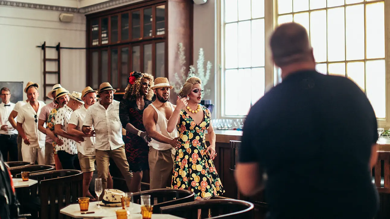 people coming in a queue with the transparent window glass
