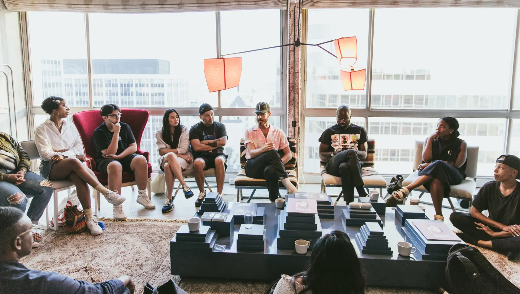 Group of People Sitting on Sofa While Discussing