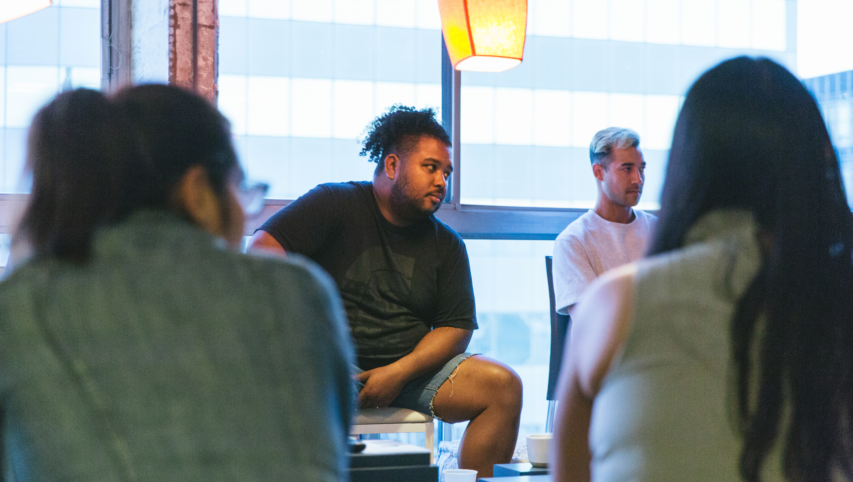 Group of People Sitting on Sofa and chair While Discussion