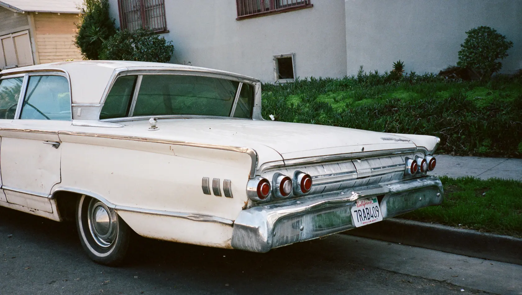 White 1963 mercury monterey parked in a road