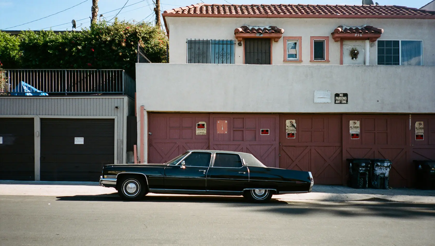 Black car standing outside the house