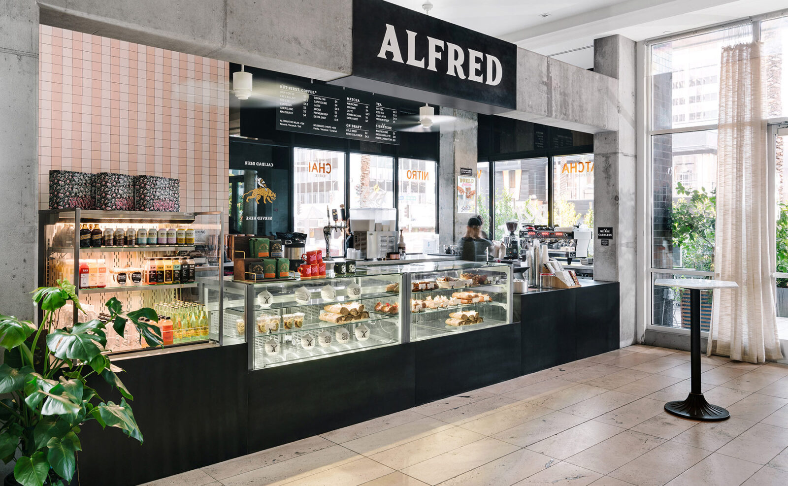A well-decorated, neat, and clean Alfred Brands bakery store with transparent glass windows.