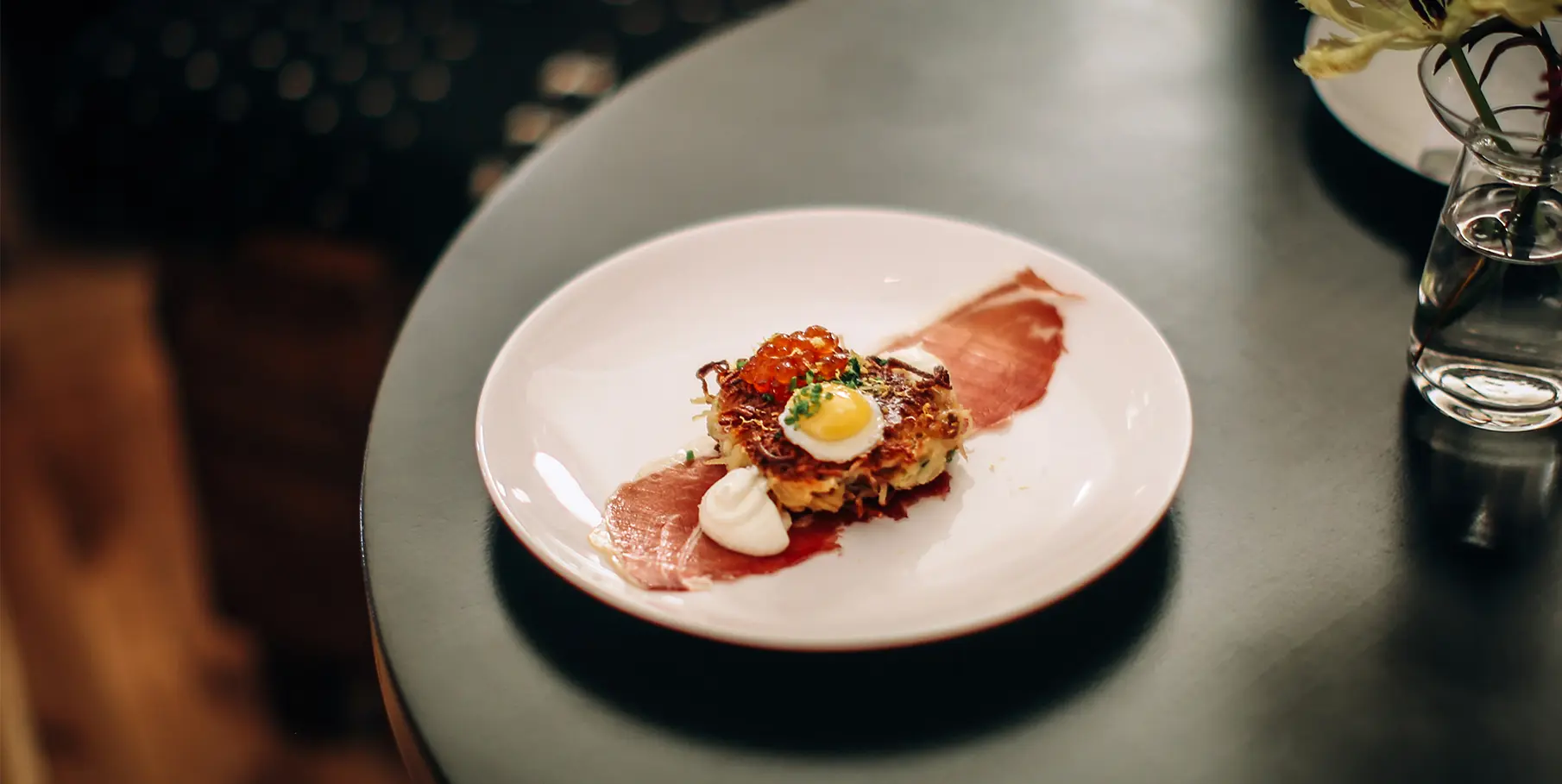 Delightful breakfast artfully presented and elegantly served on the dining table.