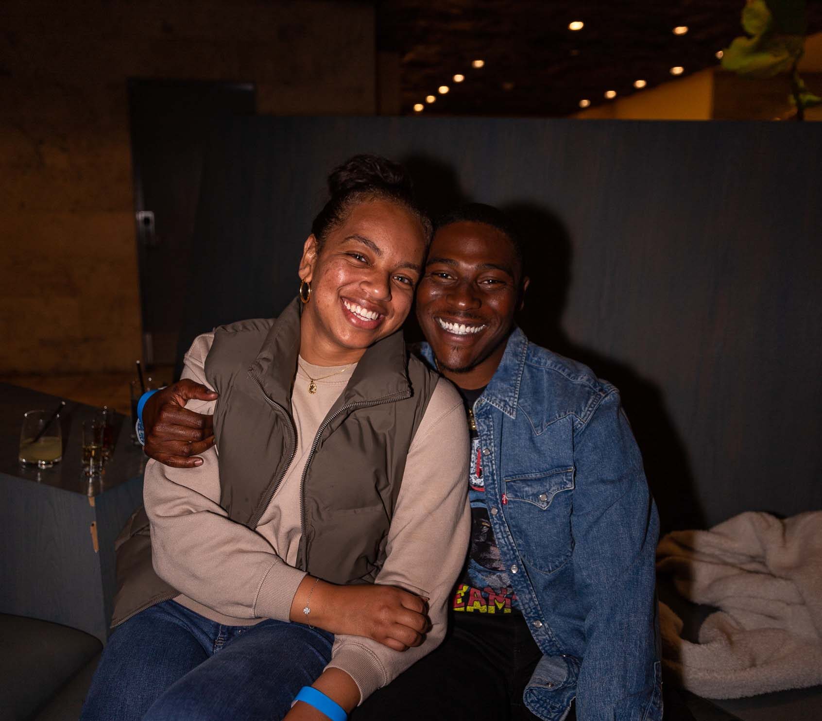 Two people smile and embrace while posing for the camera