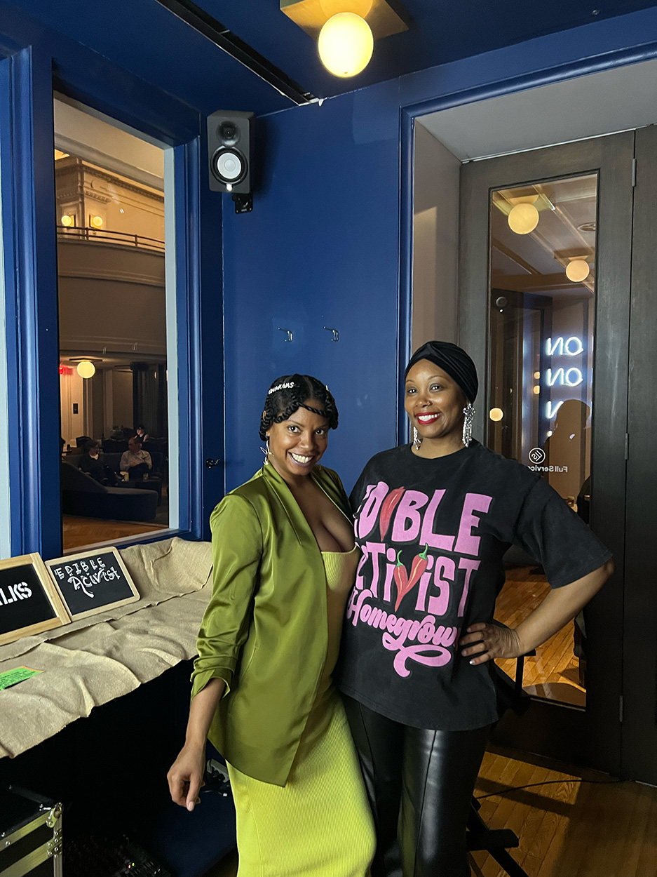 Two ladies are posing together for a photograph.