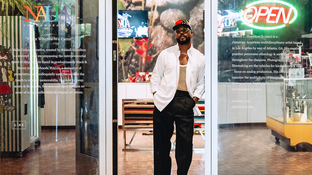 Russell Hamilton in front of Nalia Commemorative in the retail space of the LINE LA