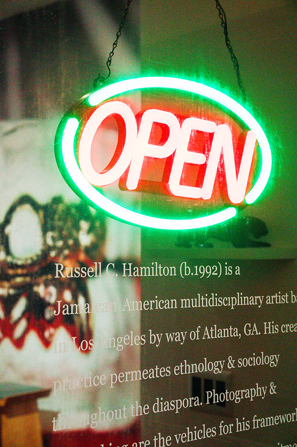 a neon open sign on the window