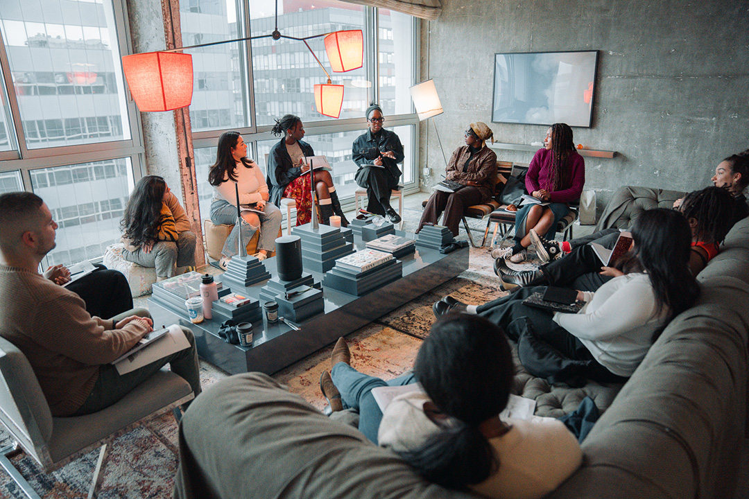 A group of people sitting around talking