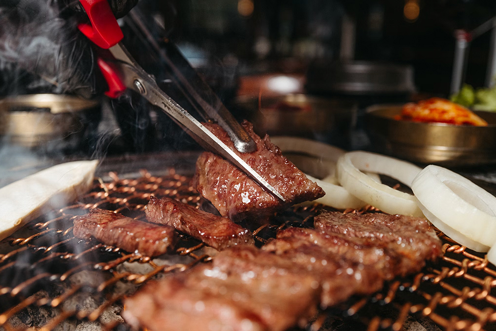 Meat being cooked at Korean barbecue