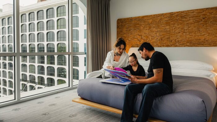family in a suite reading