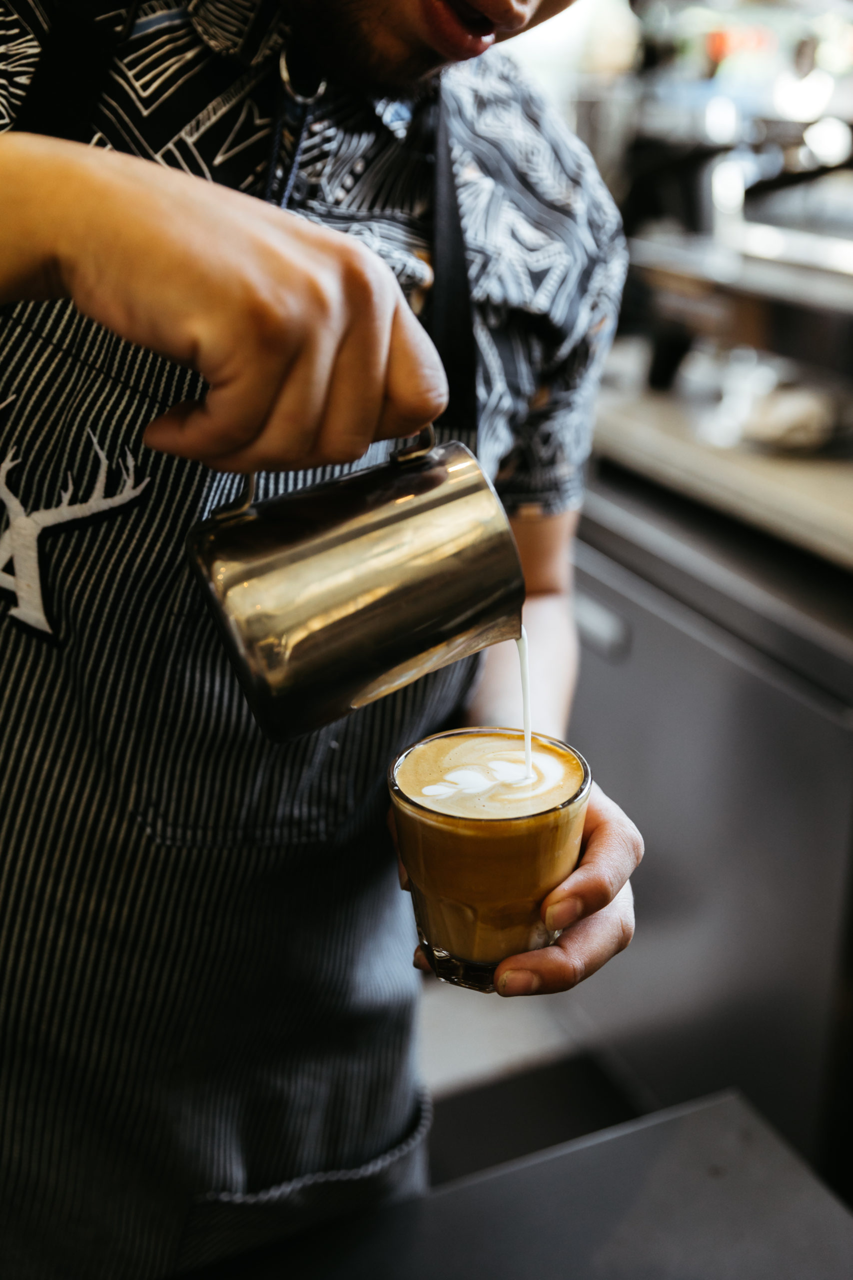 A person making hot coffee