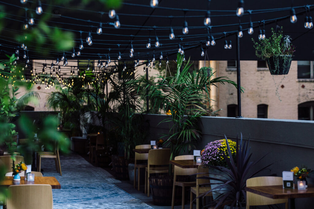 Table and chair in balcony in night with blue lights
