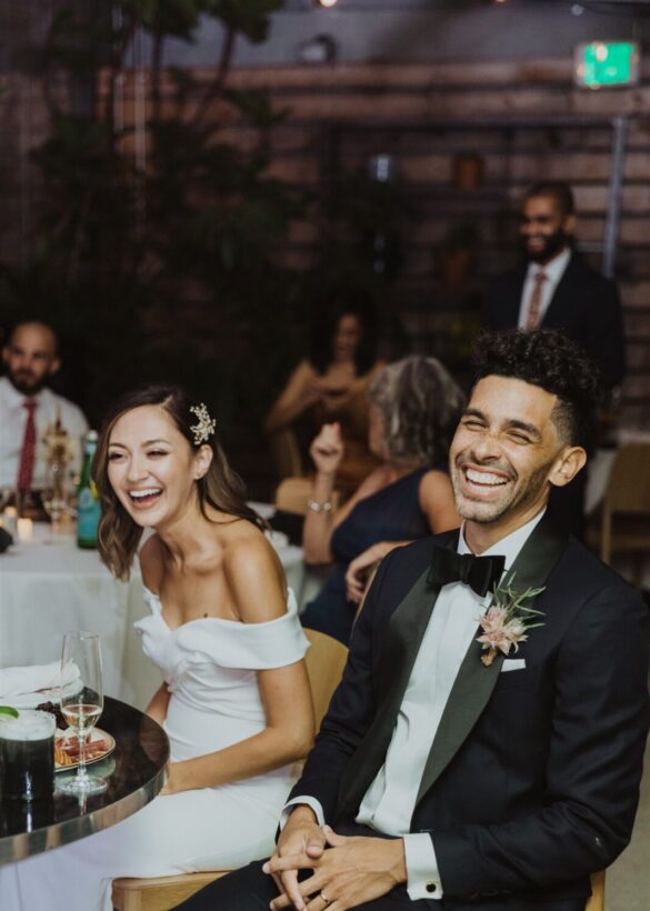 Married couple sitting and laughing 1