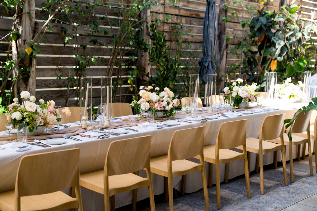 Dining table with glass and plate is set openaire wedding