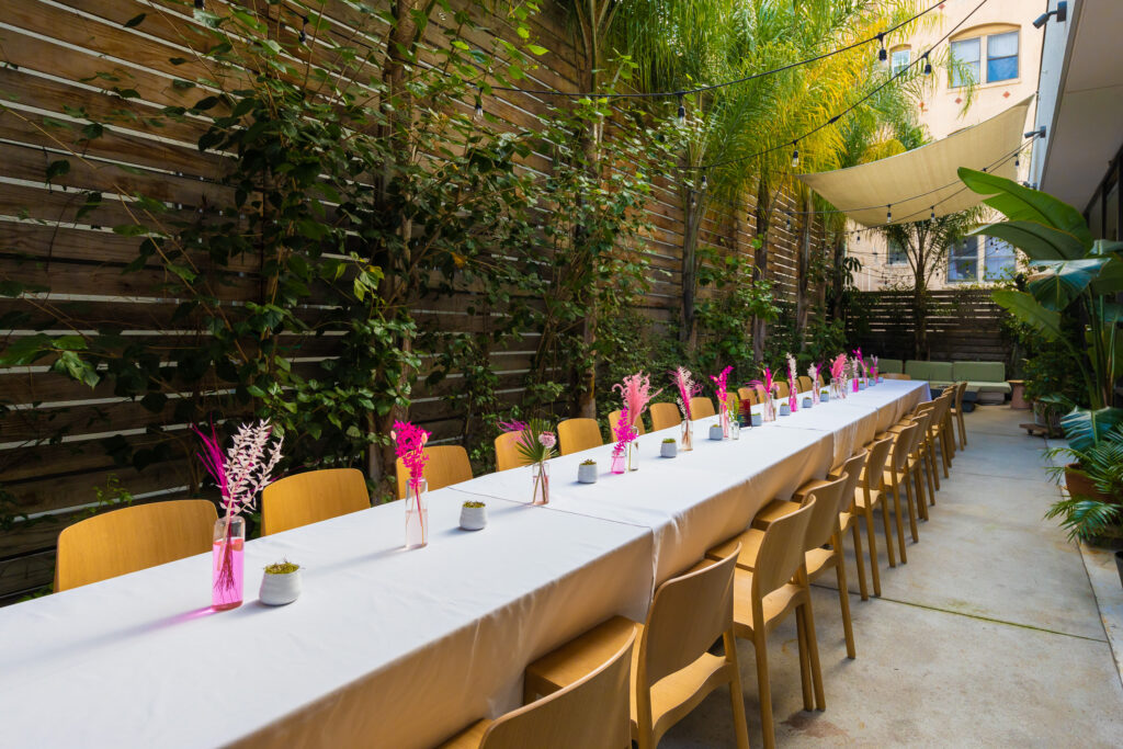 Dining table with glass and plate is set openaire wedding