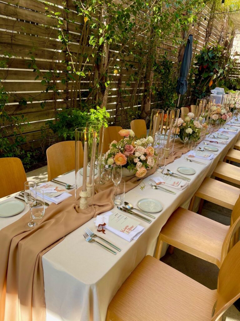 Dining table with glass and plate is set openaire wedding