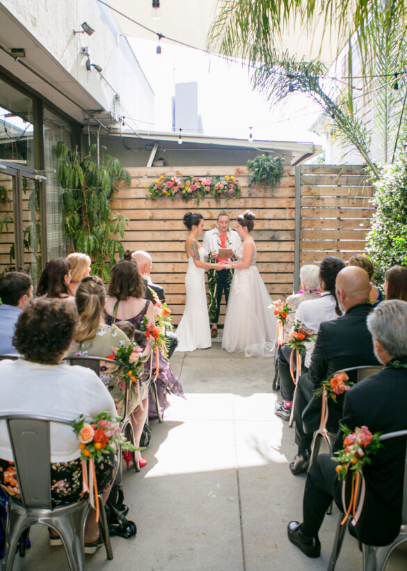 People sitting in and watching a wedding event