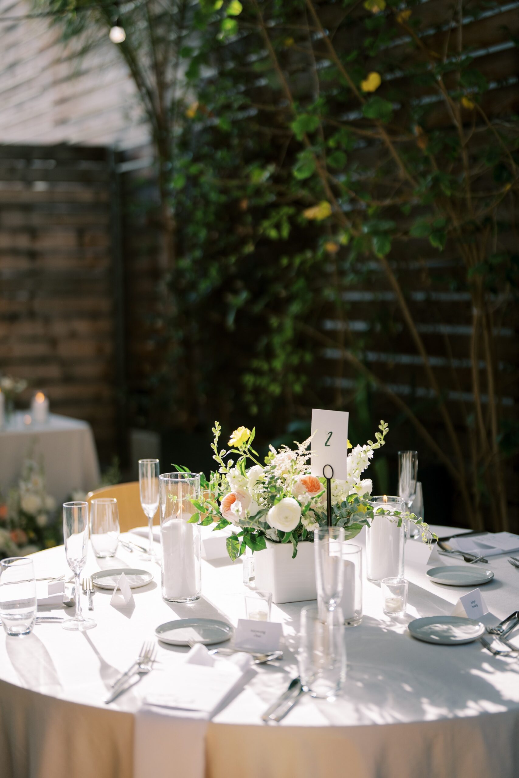 Dining table with glass and plate in openaire wedding