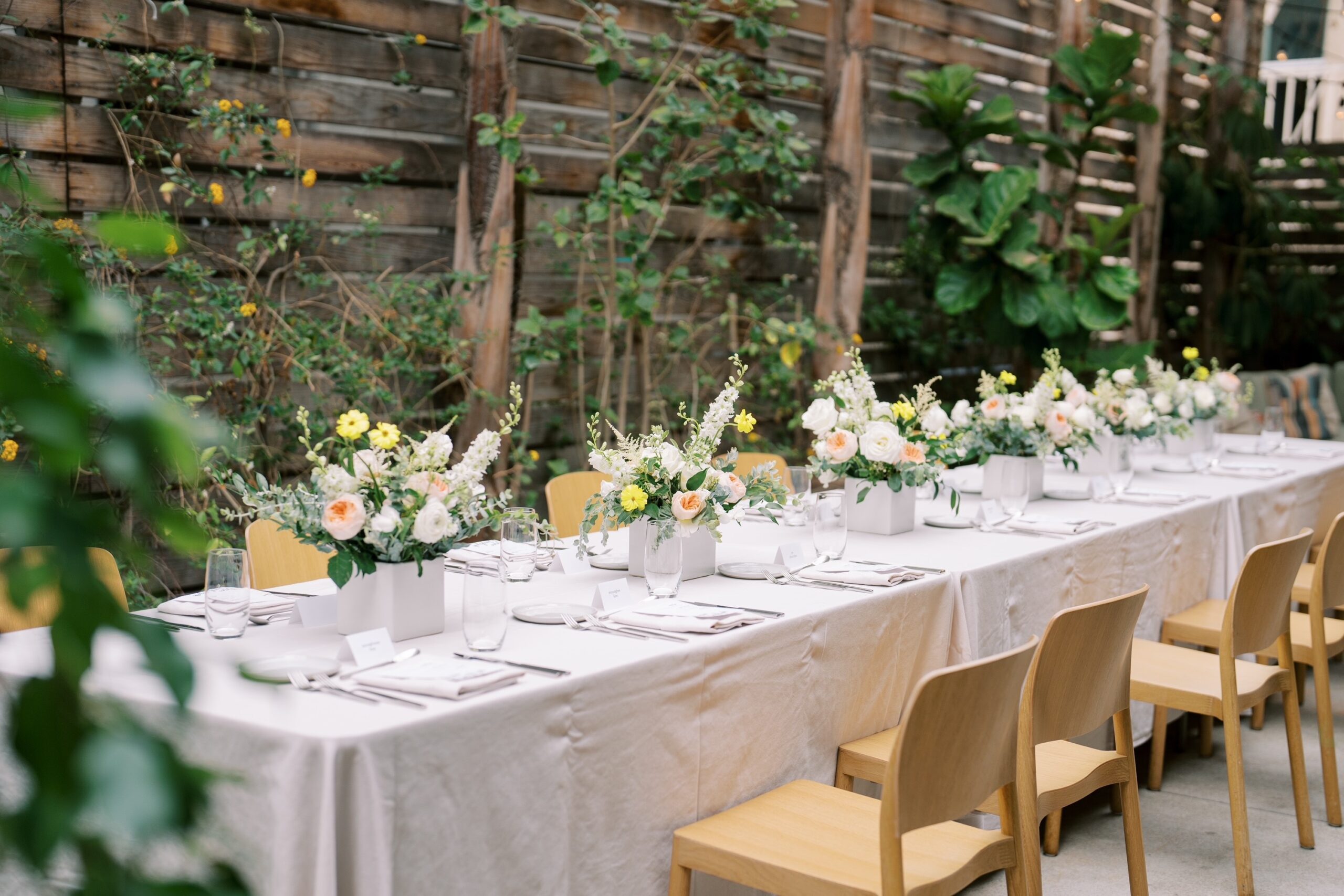 Dining table with glass and plate in openaire wedding