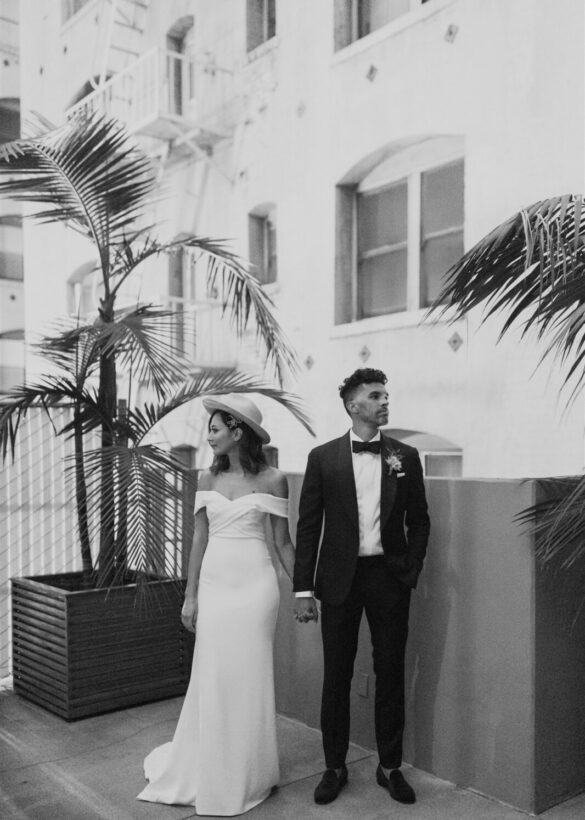 Black and white image the married couple while posing