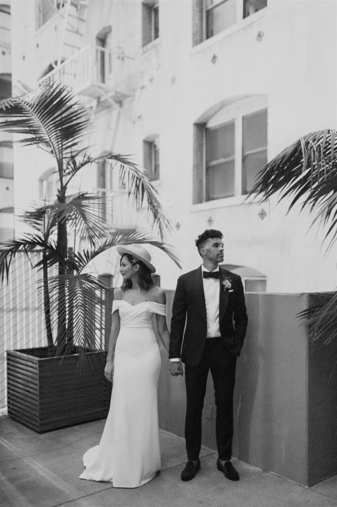 Black and white image the married couple while posing