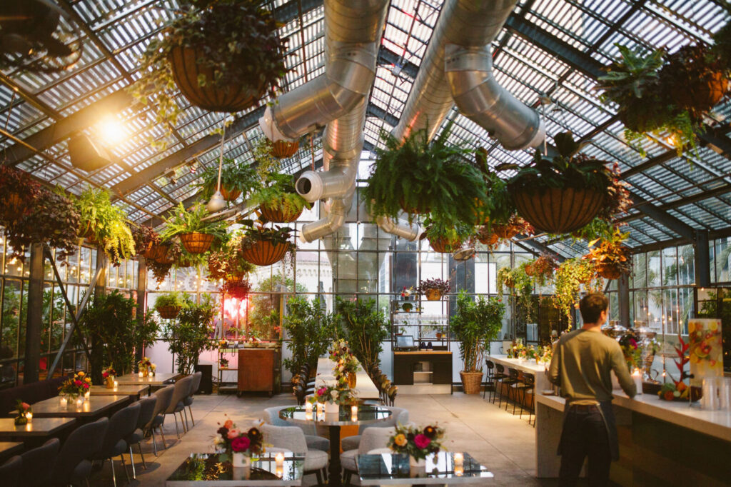 Dining table with glass and plate is set openaire wedding