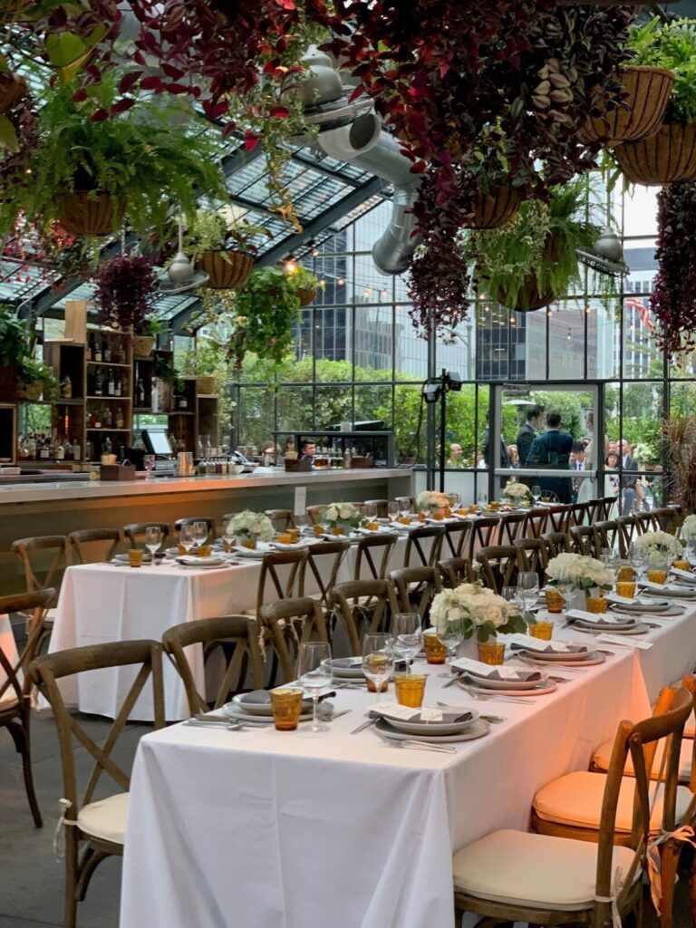 Dining table with glass and plate is set openaire wedding