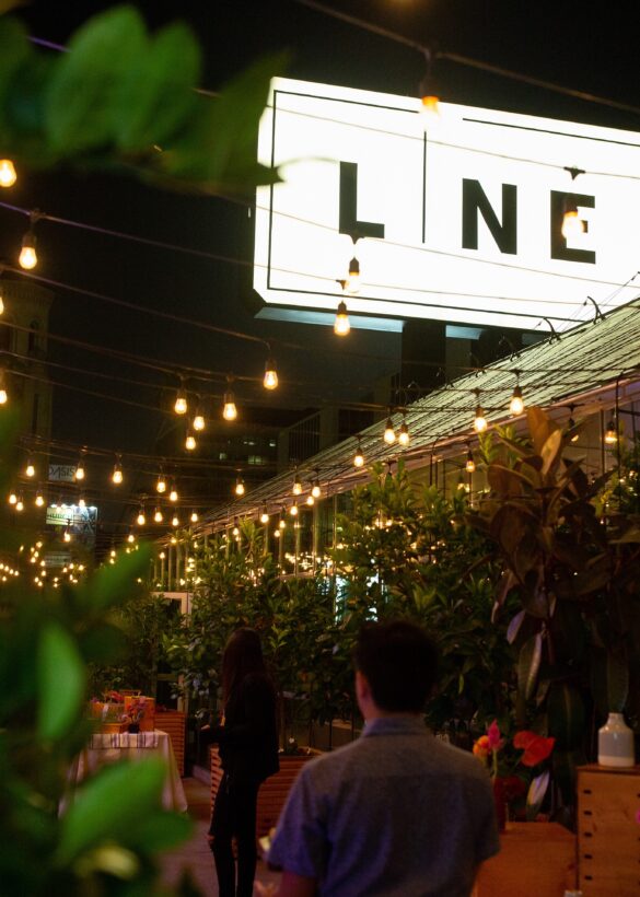 The Line logo glowing with few people walking