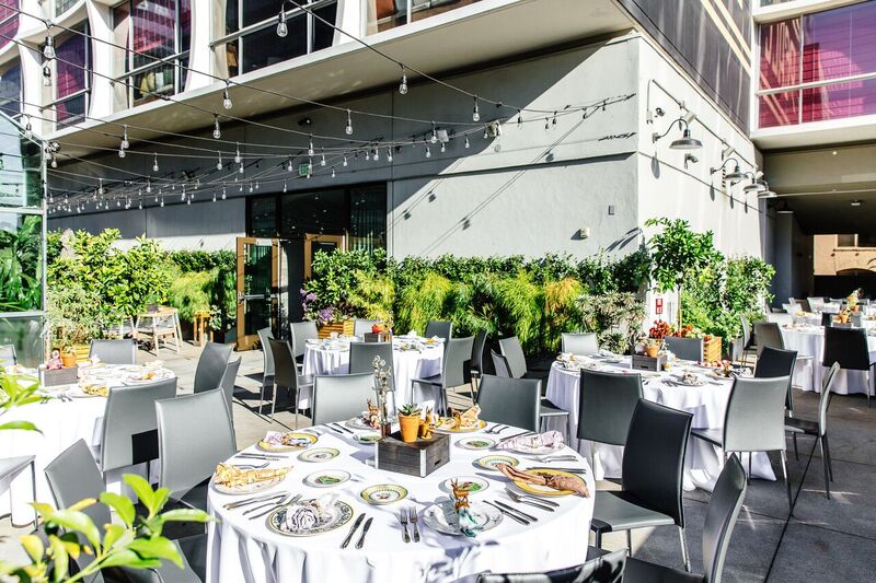 Dining table with glass and plate is set openaire wedding