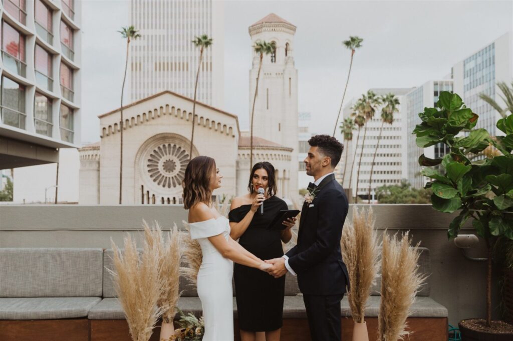 Couple holding hands in the wedding