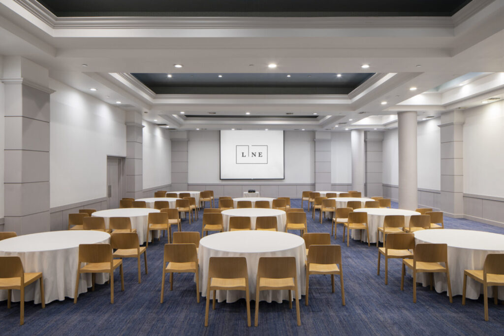 Ballroom with white table and yellow chair