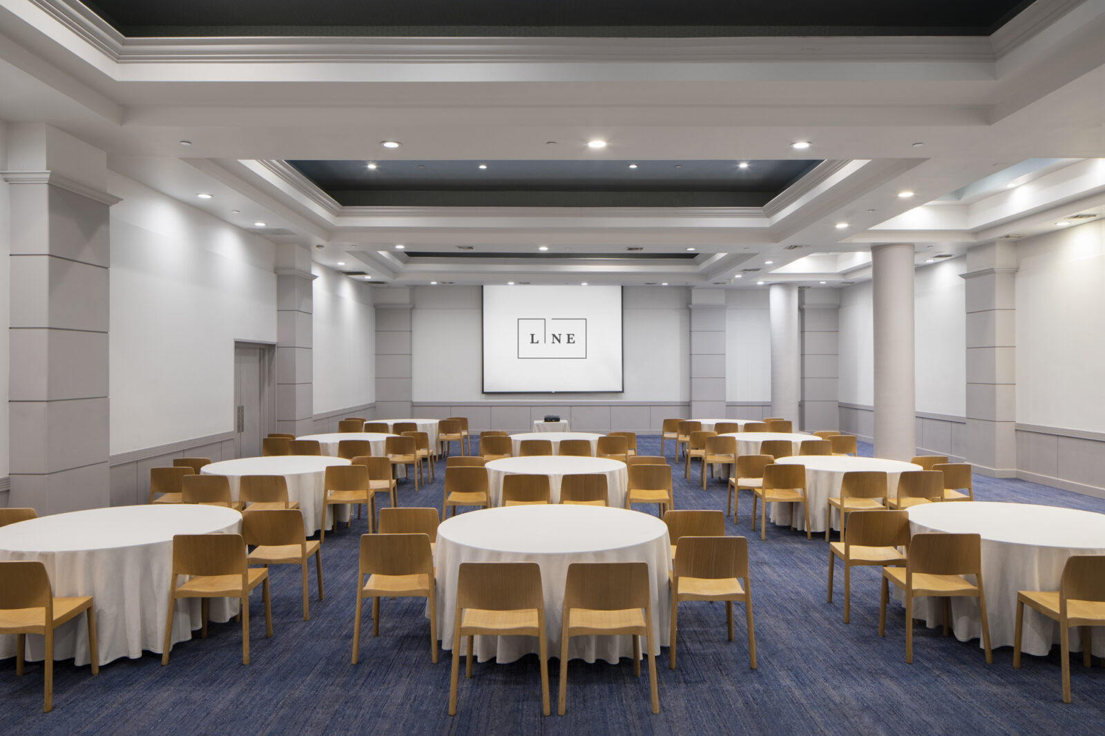 Ballroom with white table and yellow chair