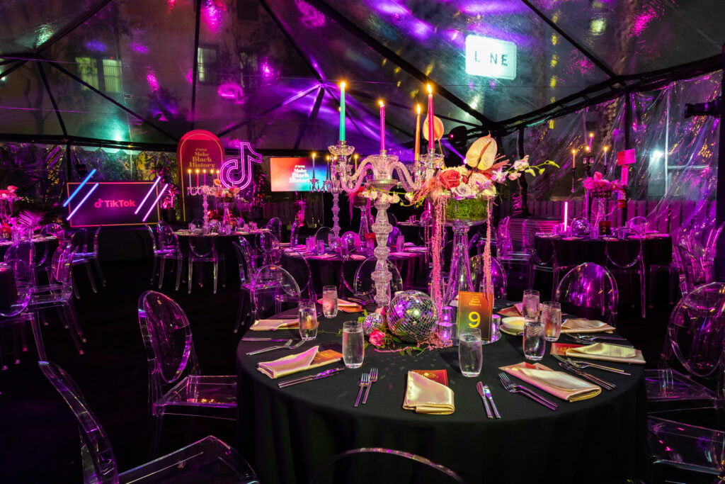 Transparent room with led lighting having dining table