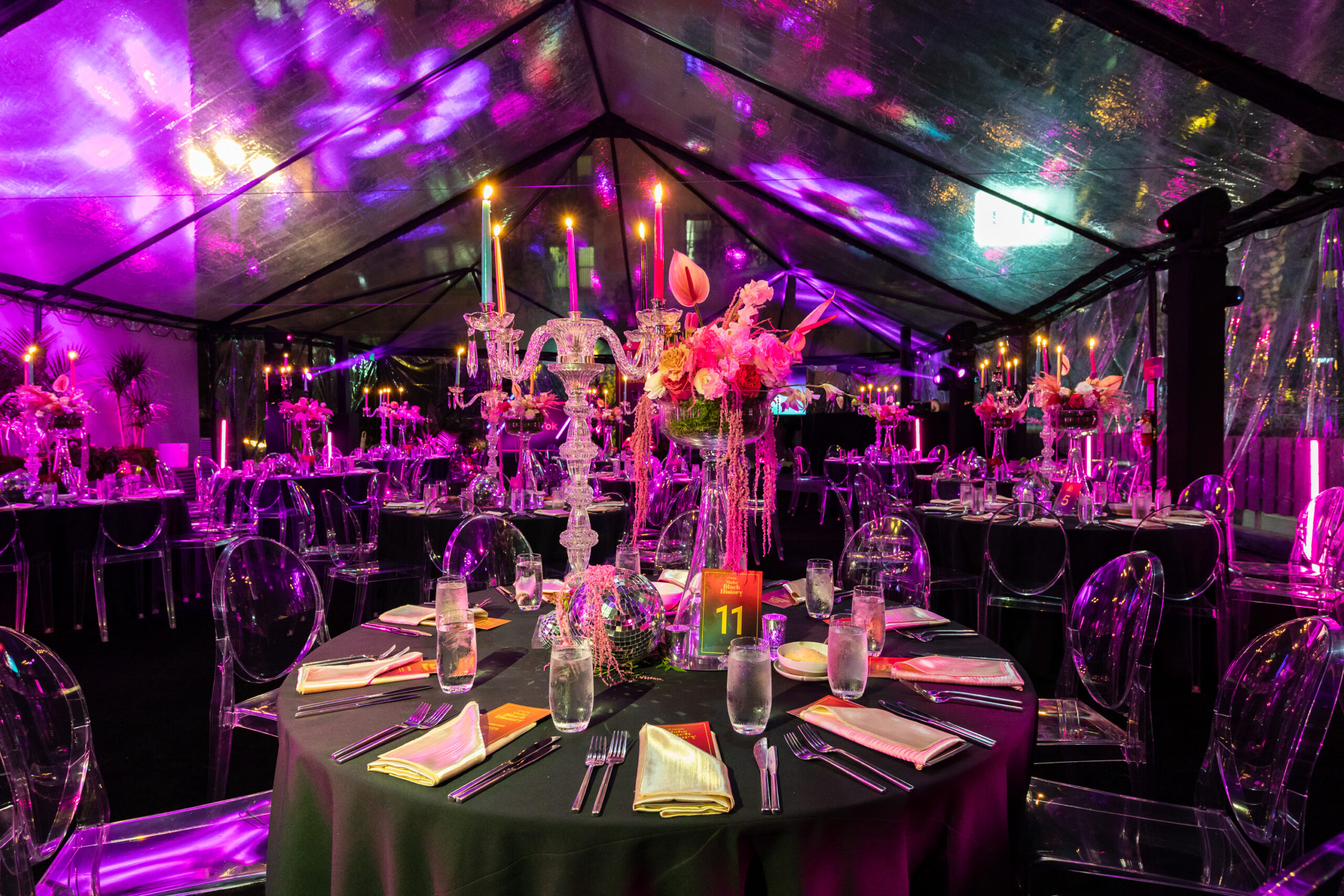 Transparent room with led lighting having dining table