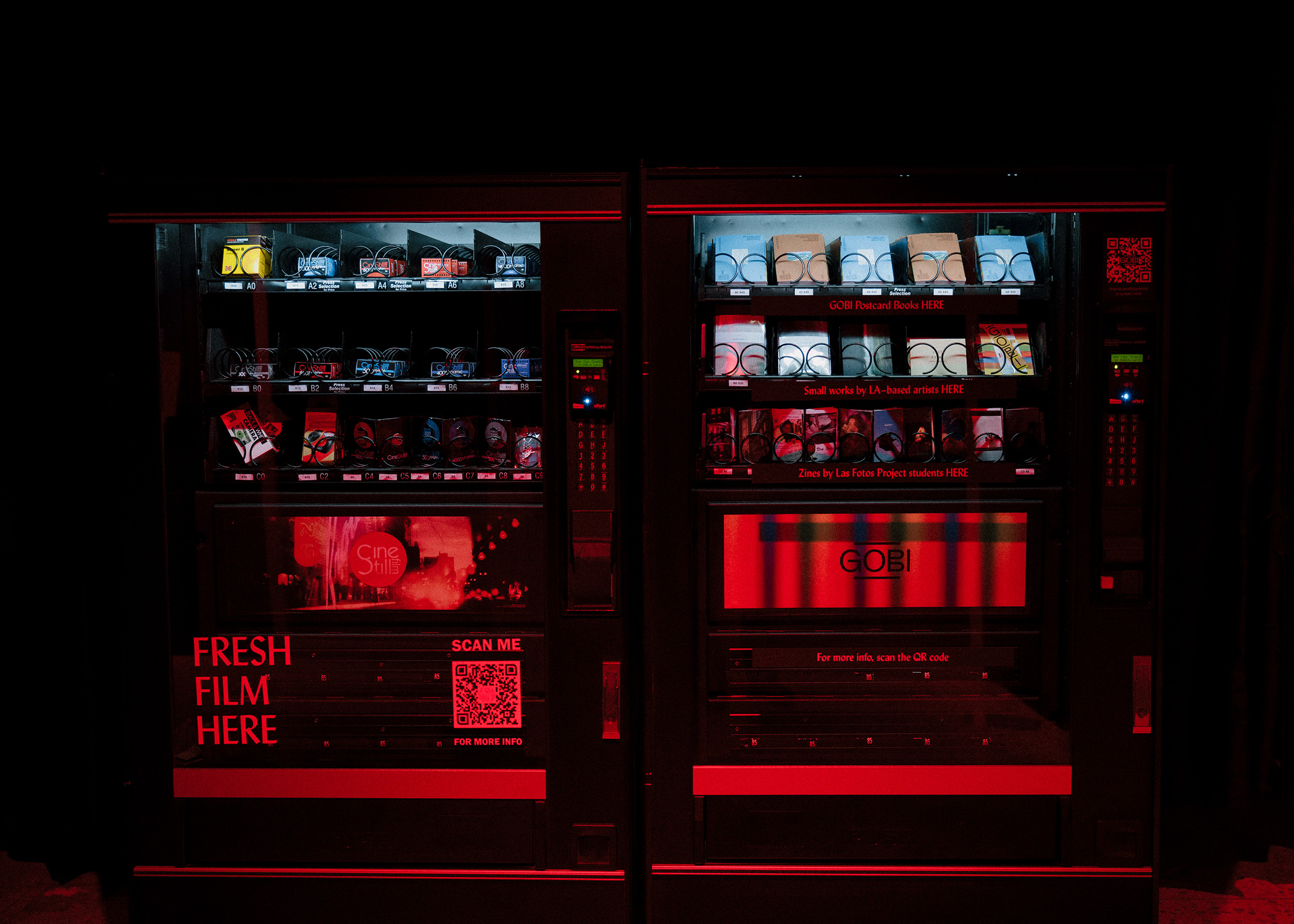 Dark Room by GOBI - two vending machines in the dark room with cameras and films