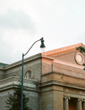 Picture of street light with an old monument