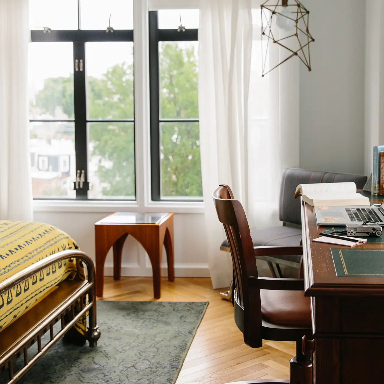 Furniture inside white room with white curtains and hanging decorator