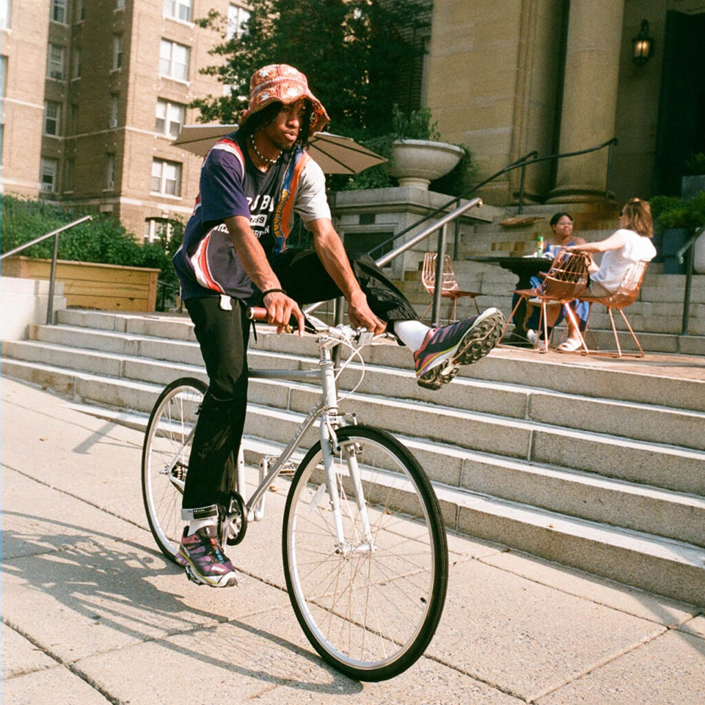 a man cycling with one leg