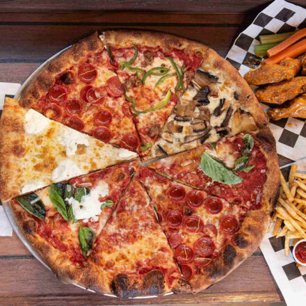 Picture of different types of pizza and toppings