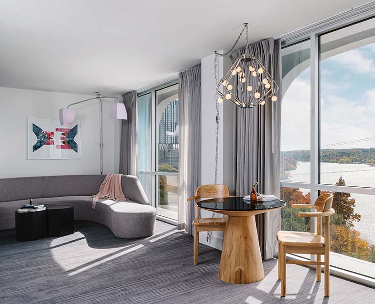 Room with sofa and tow transparent glass window